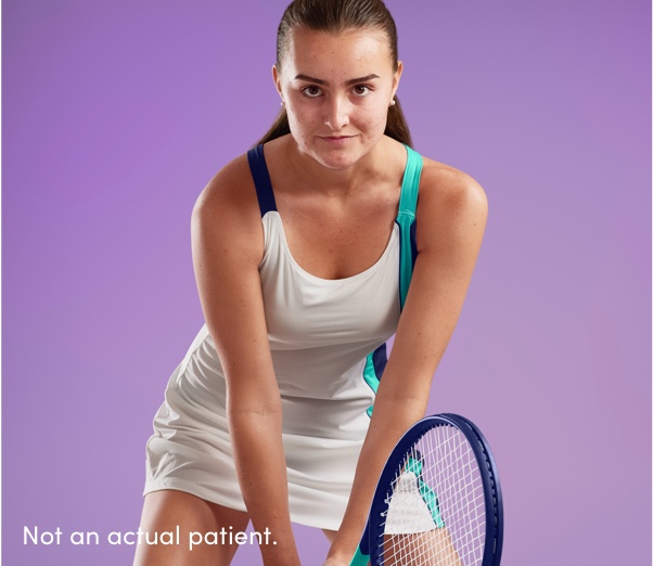 Teen girl with clearer skin ready to return tennis ball reflects AKLIEF® Cream acne treatment that works & builds confidence